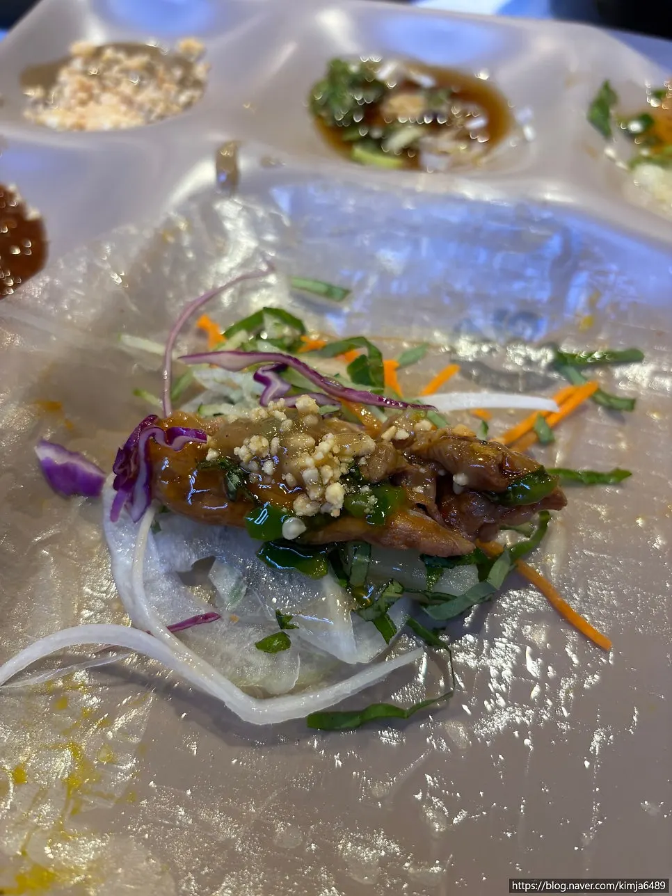 Shabu-shabu beef laid on rice paper