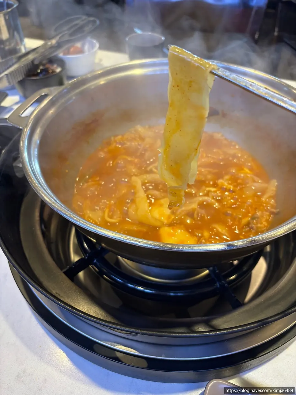 Wide kalguksu noodles soaked in broth