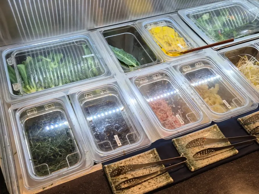 Salad bar loaded with assorted vegetables at Sodamchon