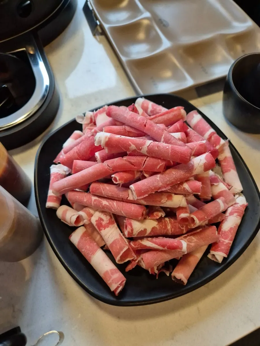 Plate of shabu-shabu meat ordered half-and-half