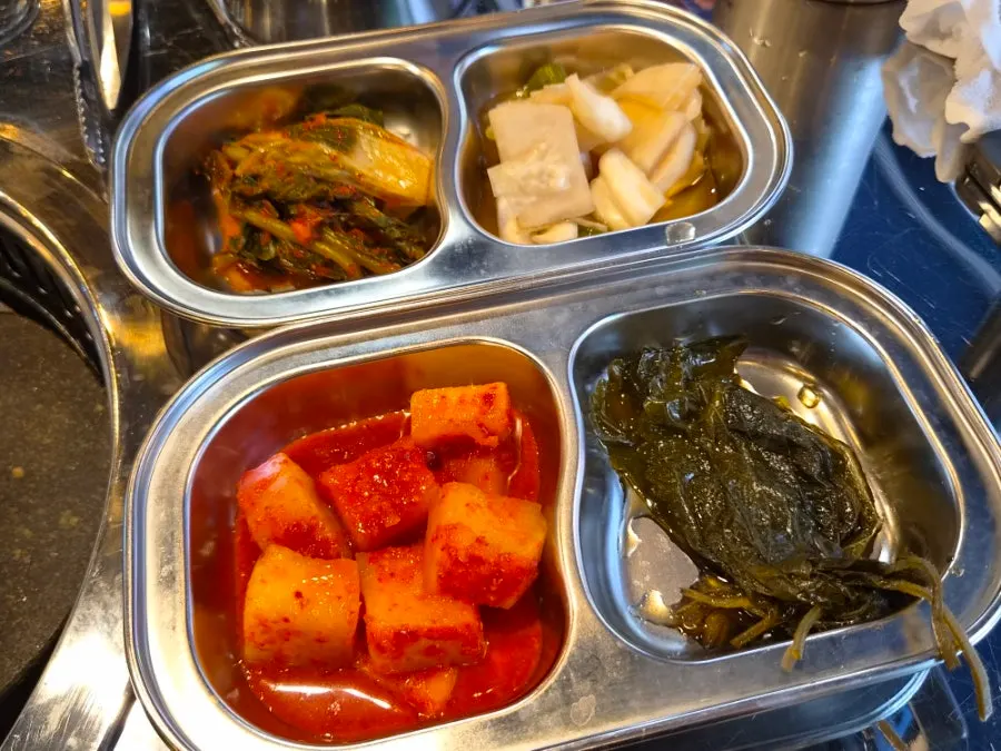 Side dishes including kkakdugi, myeongi-namul, and pa-jeori