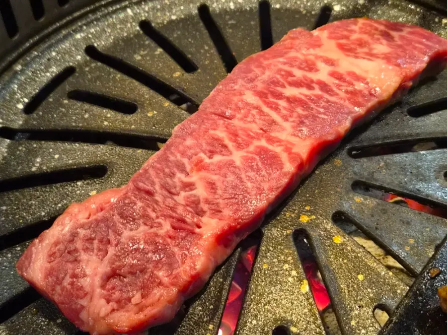 Salchi-sal grilling alongside on the pan