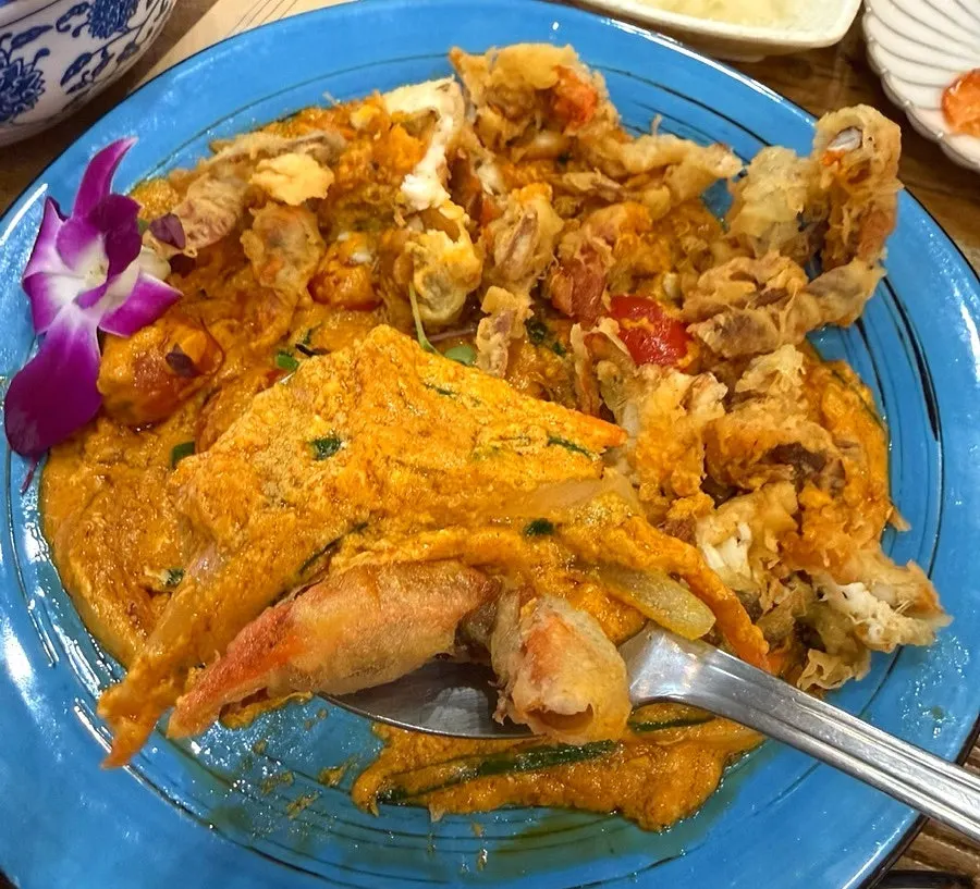 A bowl of rice served with the crab curry