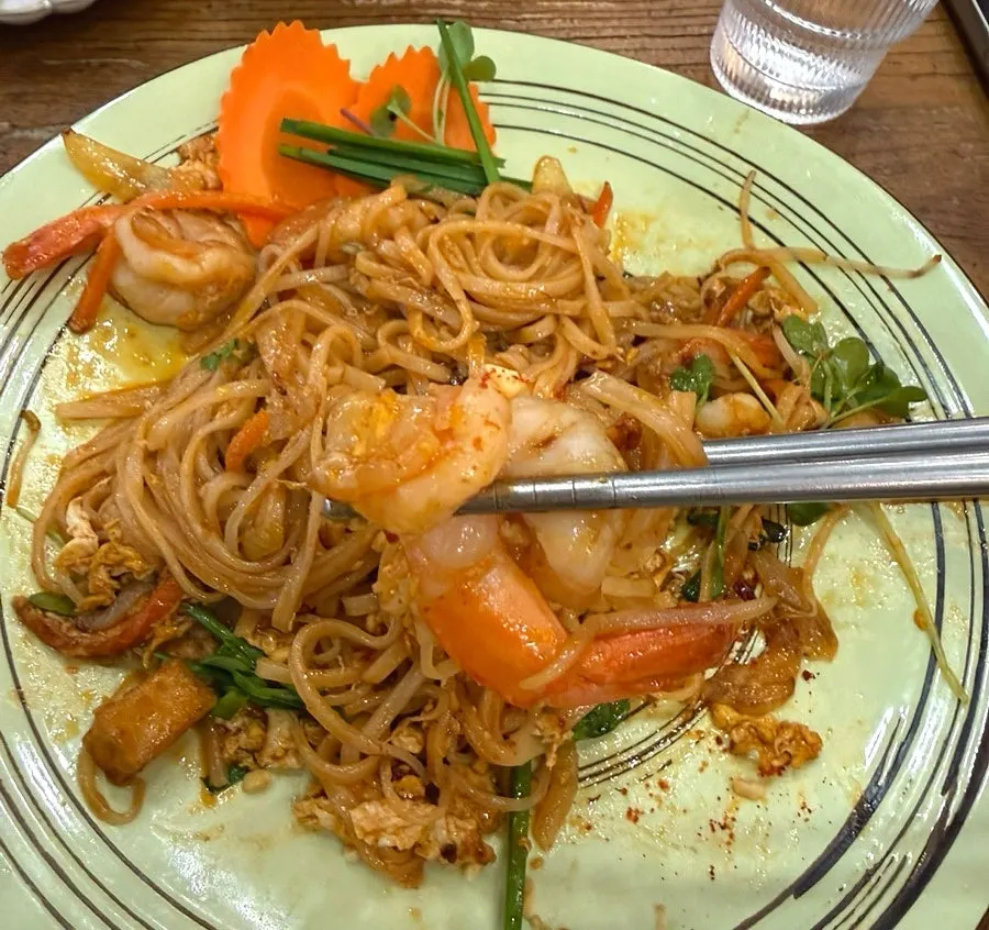 Taking a bite of the sweet pad thai