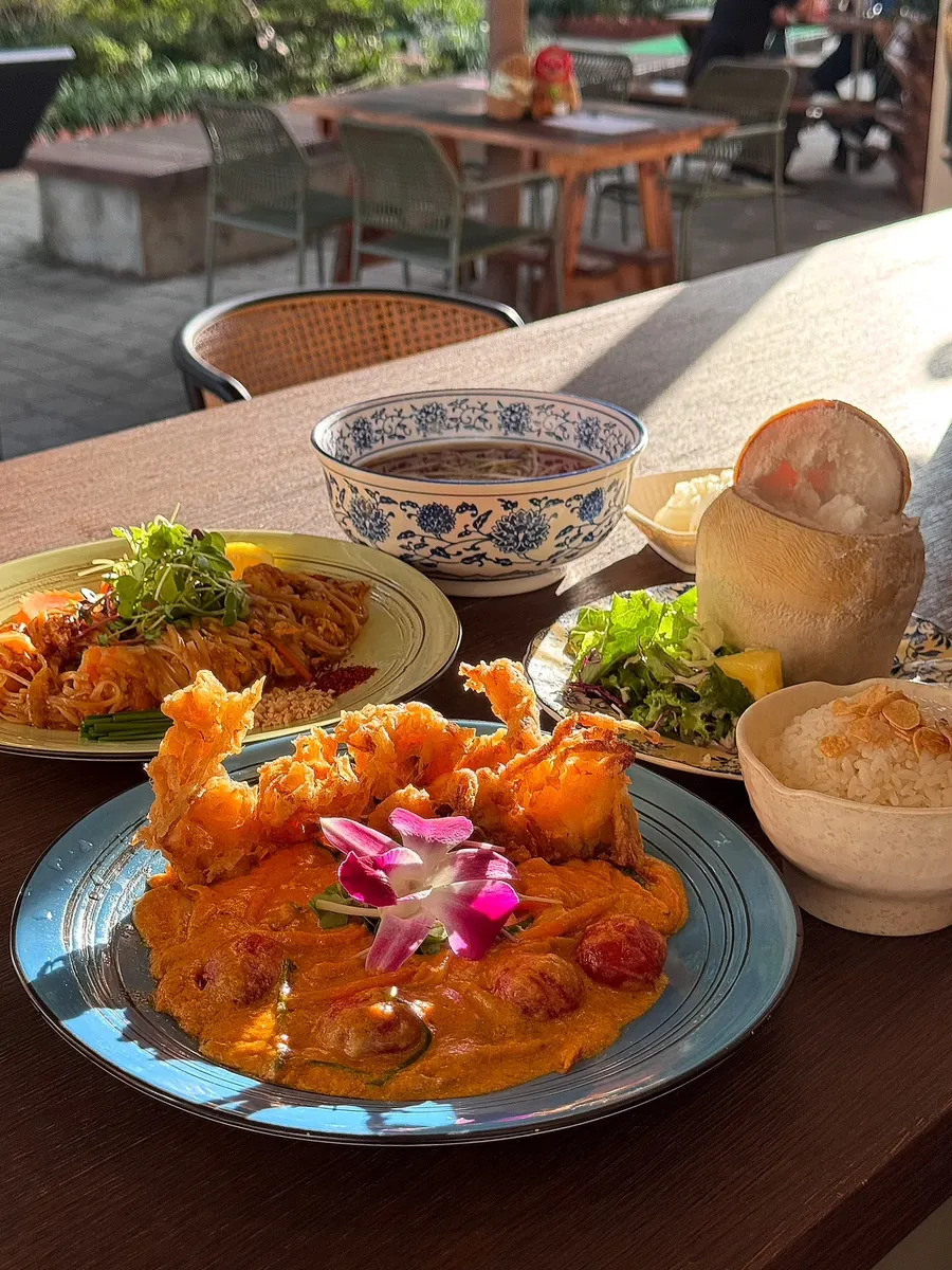 Table set with pad thai and curry together
