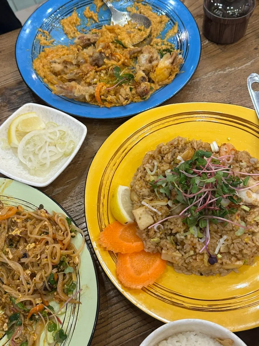 A plate of pickled onions paired with Southeast Asian food