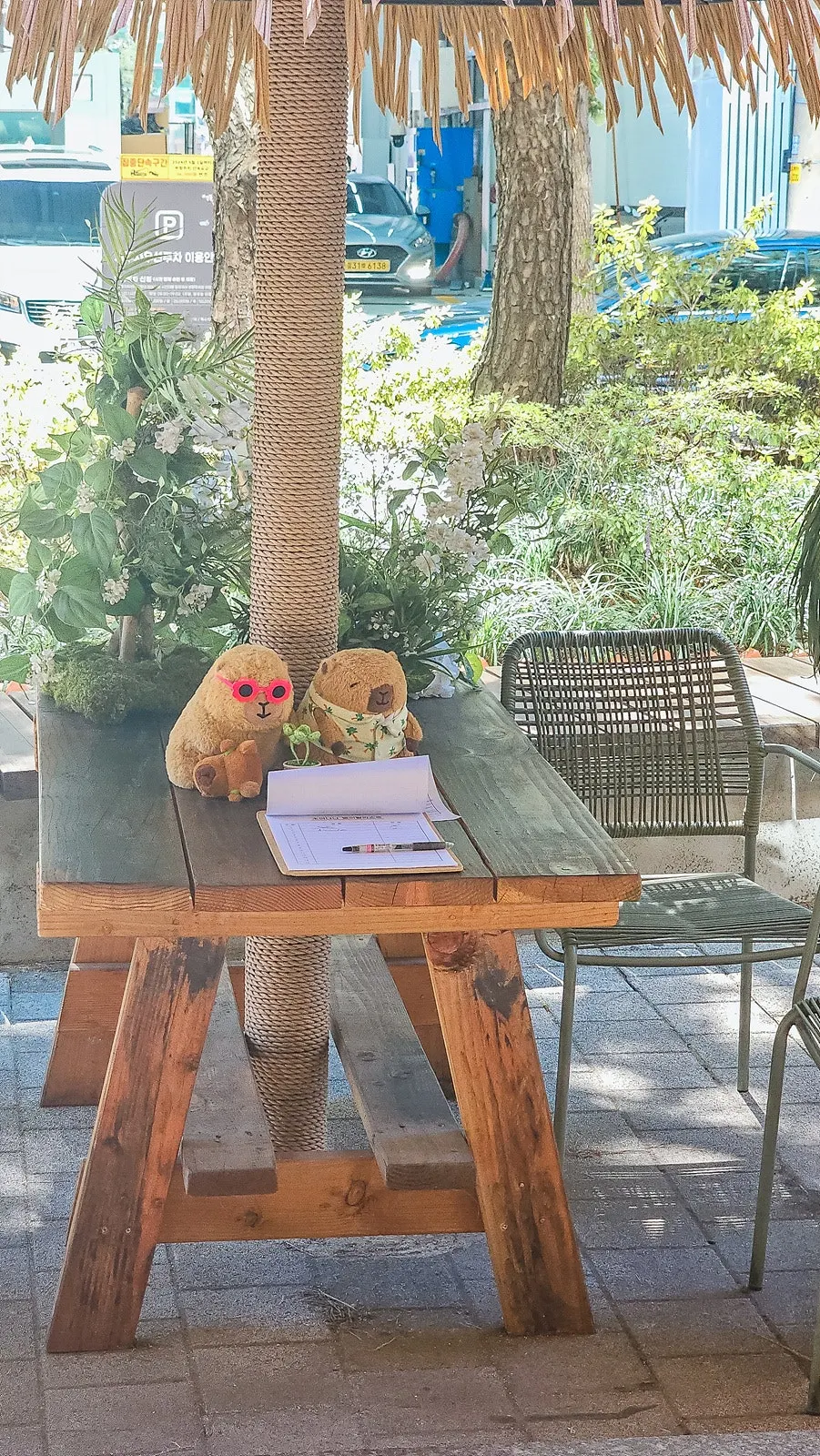 Outdoor waiting area and waitlist sheet at Soi Nana Seongsu