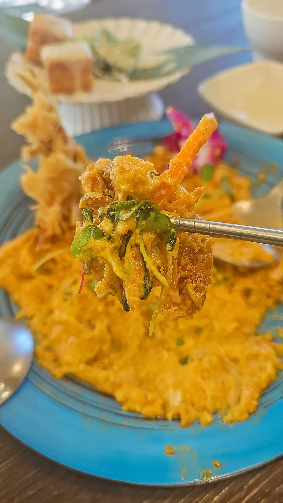 Fried soft-shell crab on top of the coconut milk curry