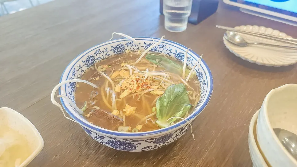 A bowl of Soi Nana's braised beef shank rice noodle soup