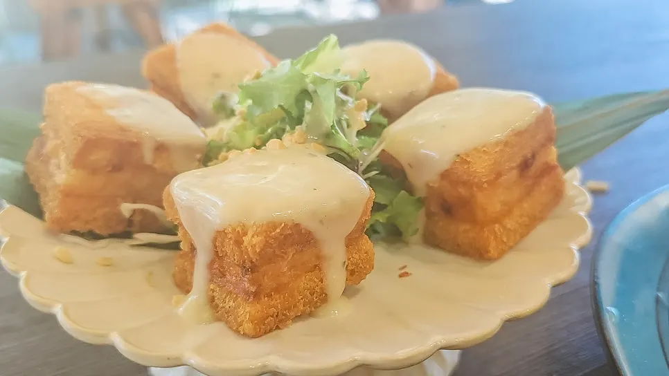 Soi Nana's menbosha served with lemon cream sauce