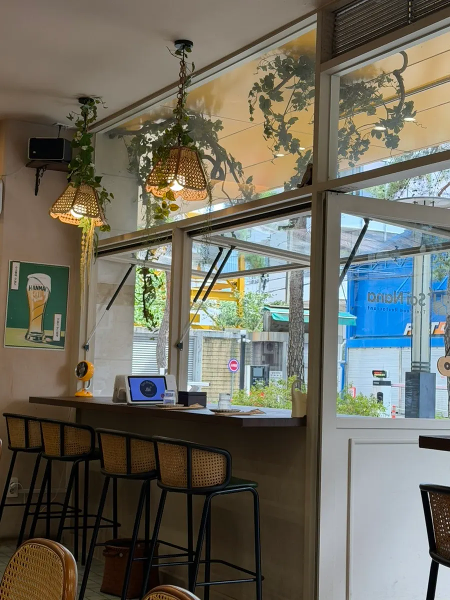 Interior with rattan lighting and palm-leaf parasols