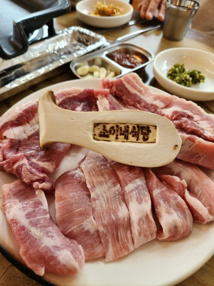 Combo platter of scored pork belly, Jirye black pork neck, and pork jowl