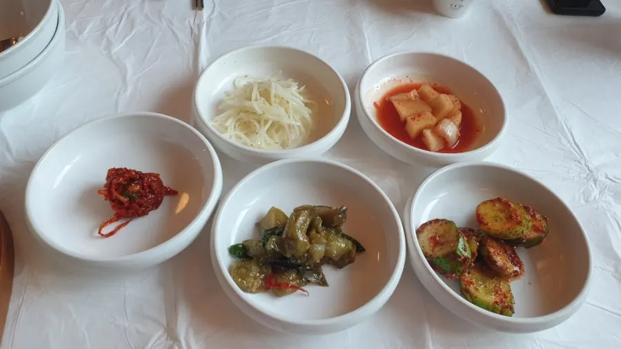 Table spread of side dishes at Bigeumdo