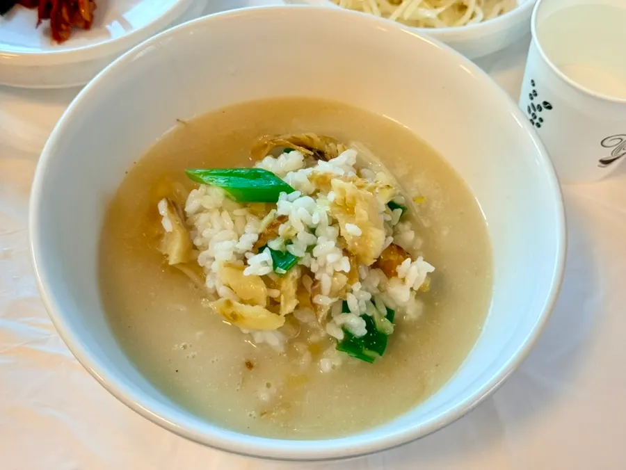 Spoonful of pollack soup packed with pollack and bean sprouts