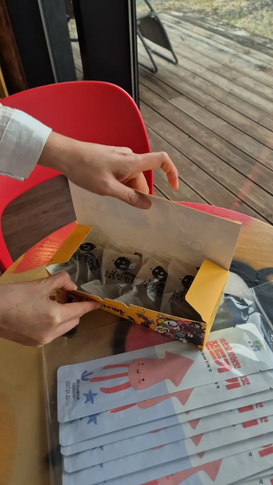 Two packed boxes of potato bread and jjondeugi sets