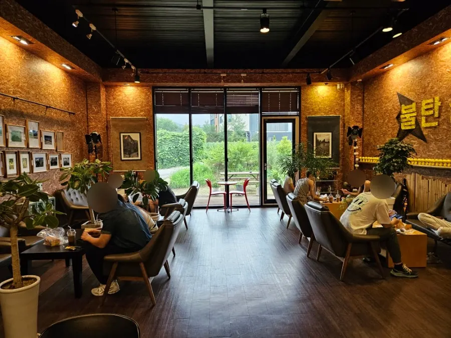 Interior lit by the floor-to-ceiling window