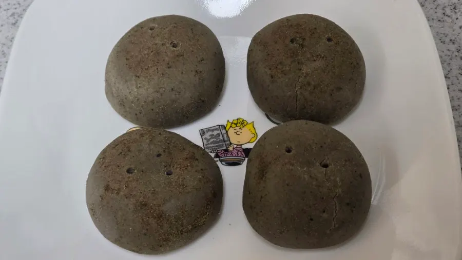 Cross-section of halved potato bread showing potato-packed interior