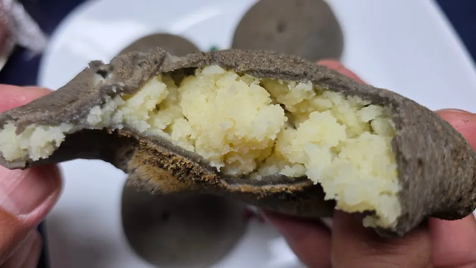 A piece of potato bread reheated to a chewy texture