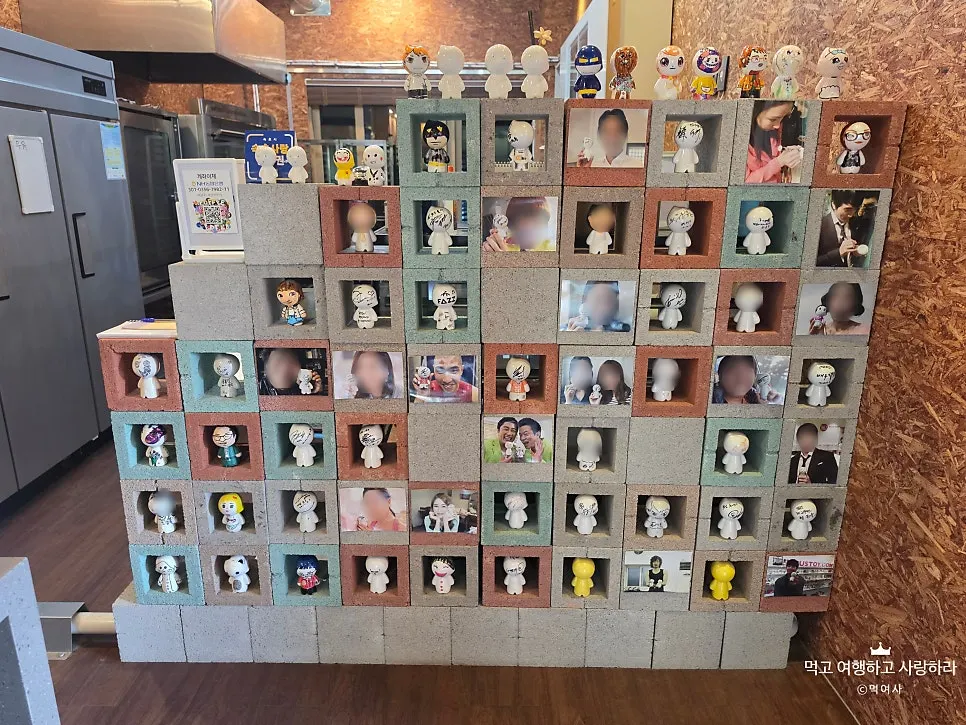 Muse-toy figures displayed on a brick-shaped shelf