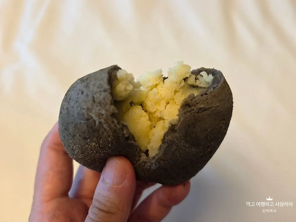 Cross-section of potato bread showing cream cheese potato filling