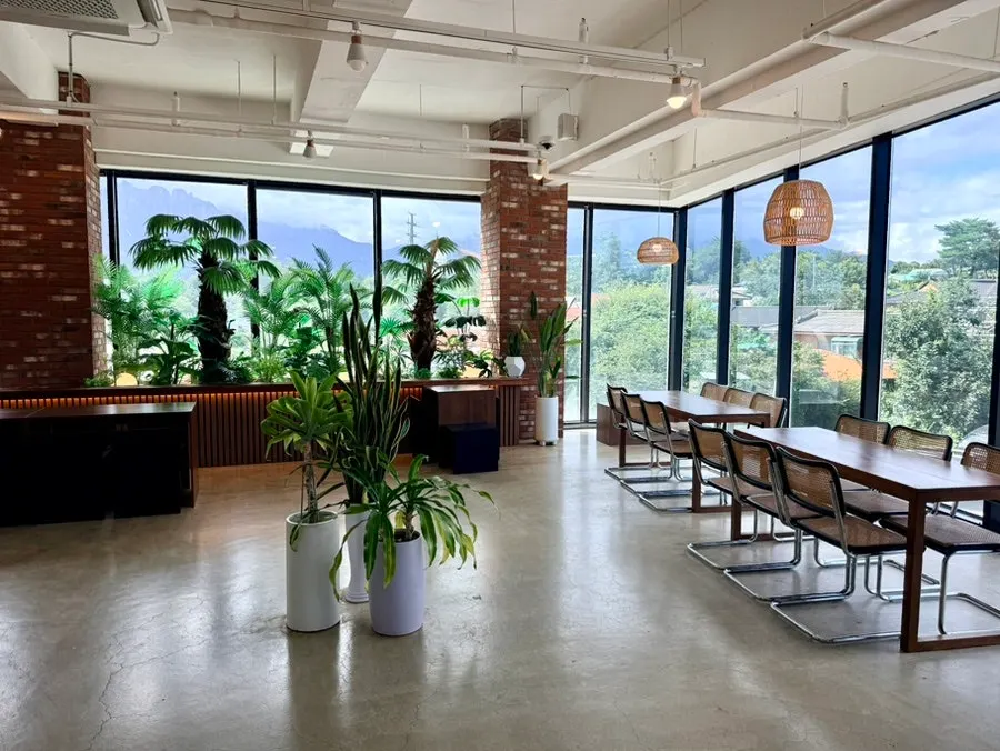 2nd-floor hall with Ulsanbawi Rock visible through the floor-to-ceiling windows