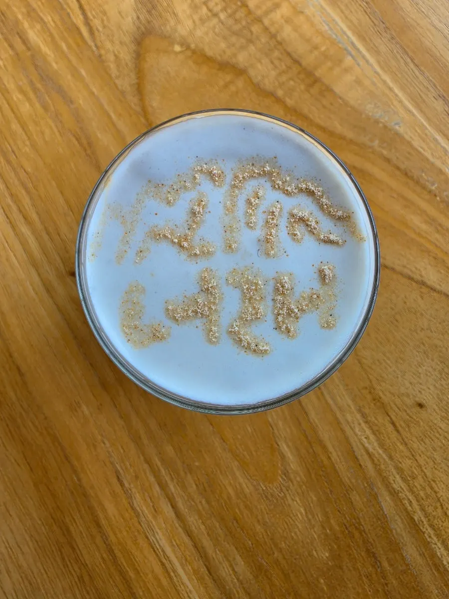 Signature Neorae Latte topped with cream