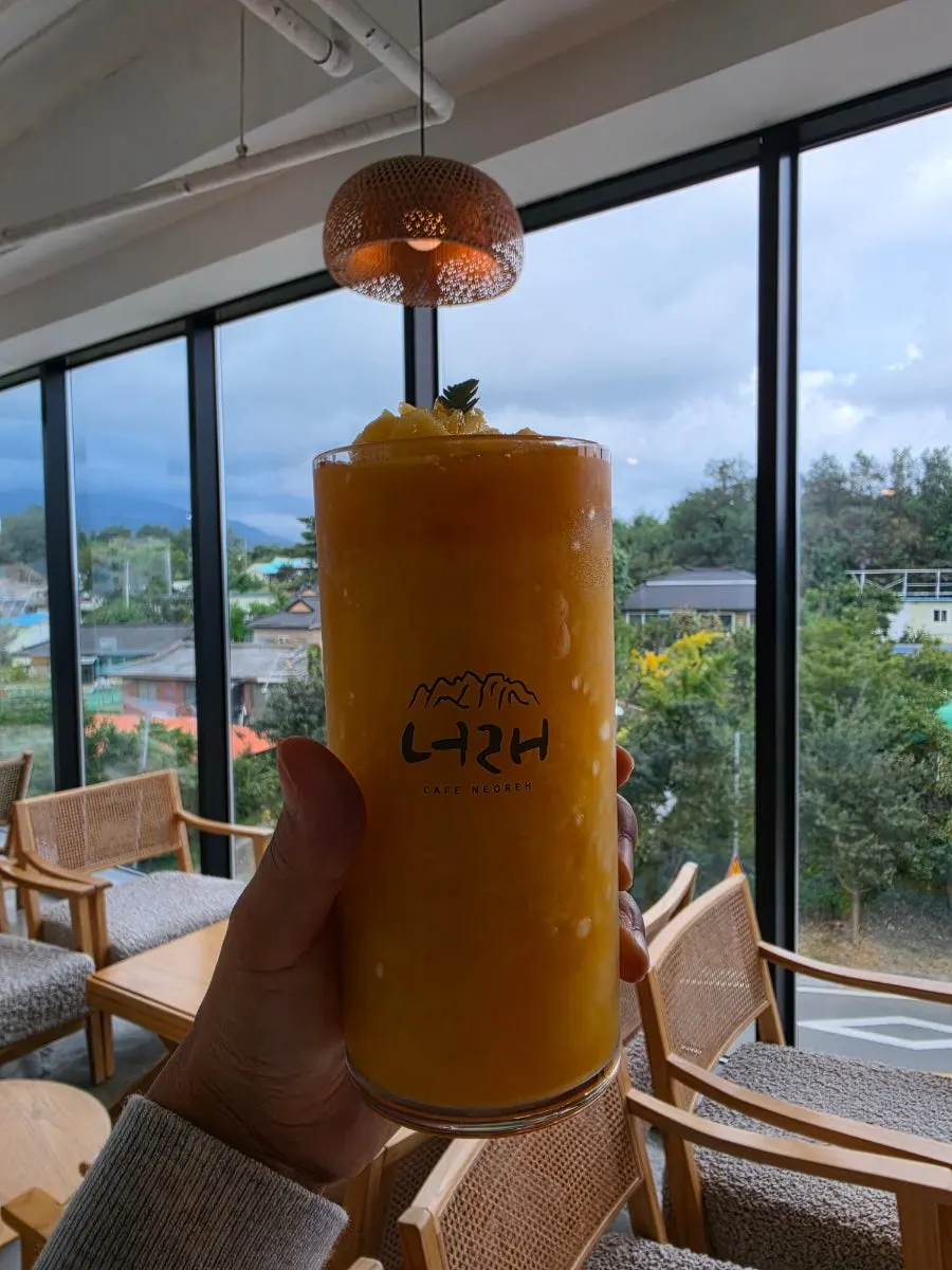 Table at Cafe Neorae with mountain view outside the window