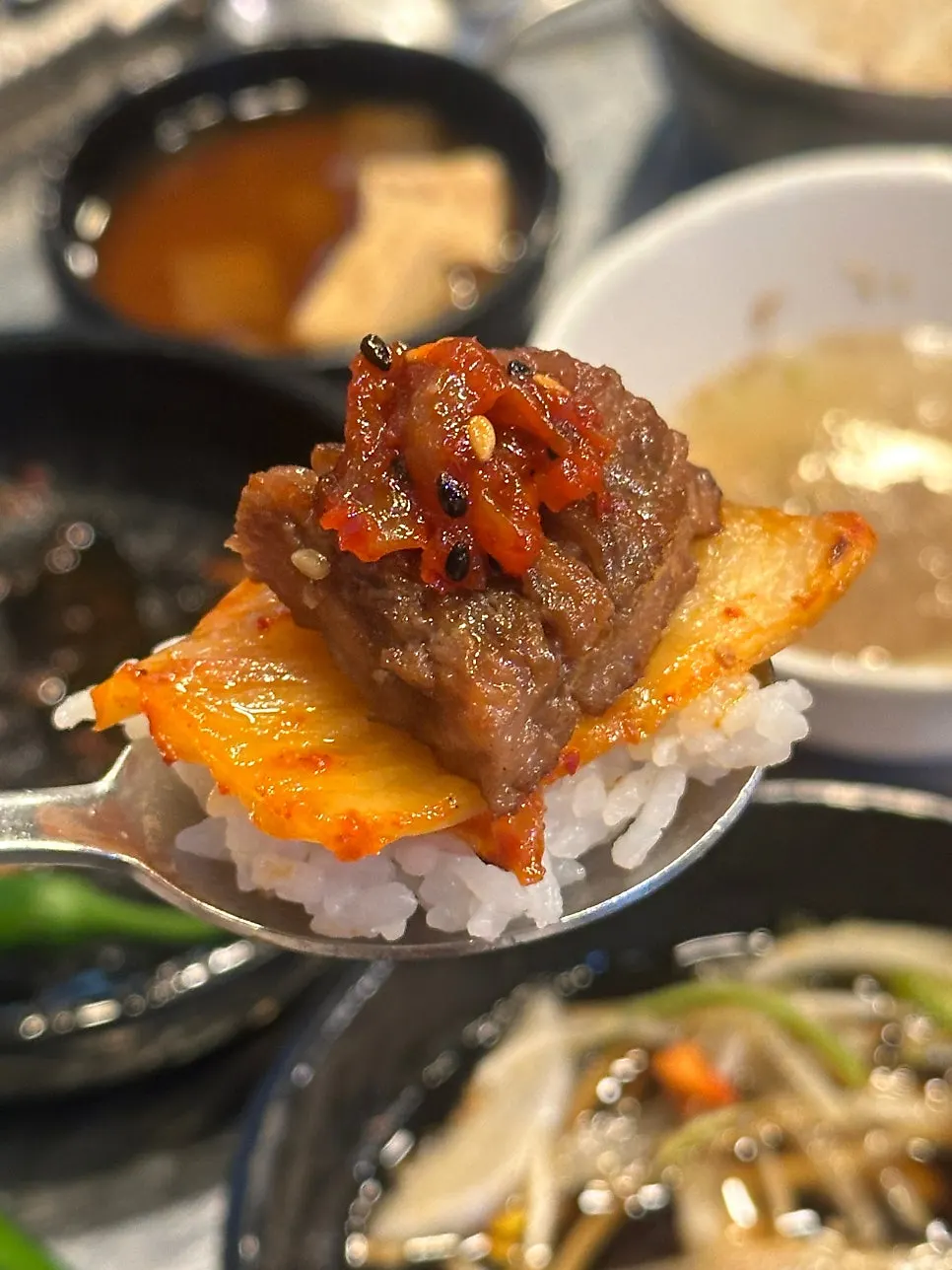 House-marinated pork ribs eaten with scallop jeotgal