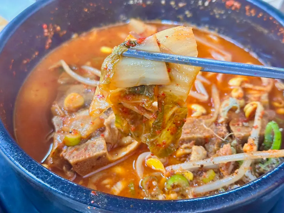 Tender meat picked off the bone with chopsticks