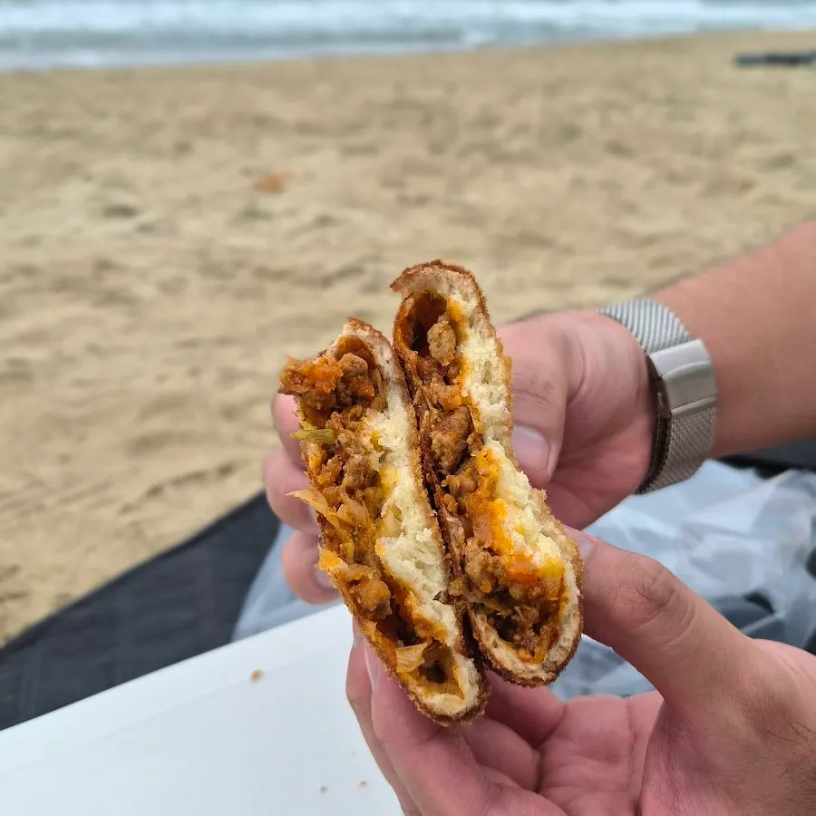 Eating croquettes by the sea
