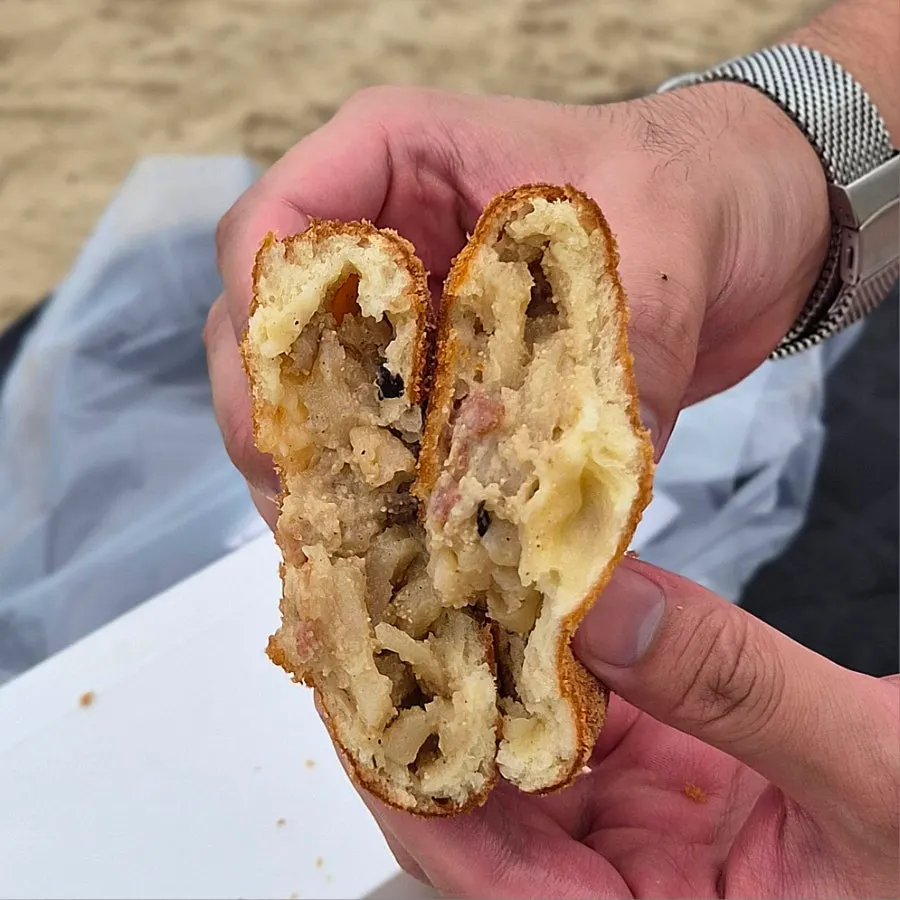 Cross-section of a red crab croquette