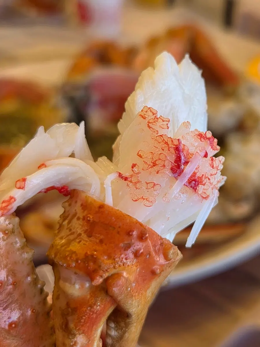 Crab legs eaten with the provided tool