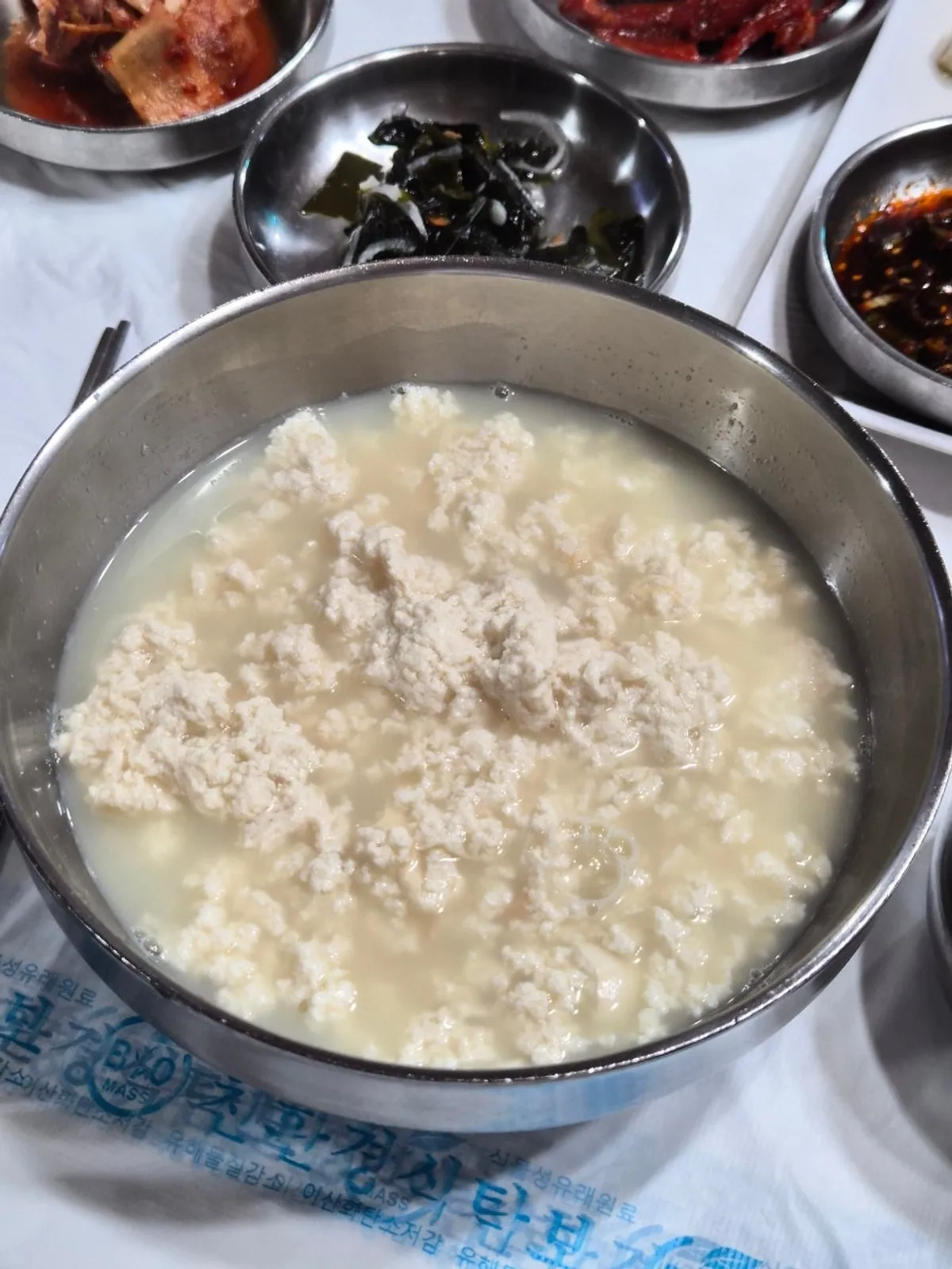 A bowl of pale, soft-curdled cho-dang sundubu