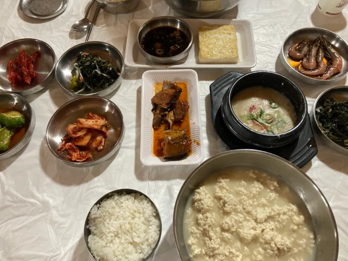 Breakfast table set with chodang sundubu and banchan