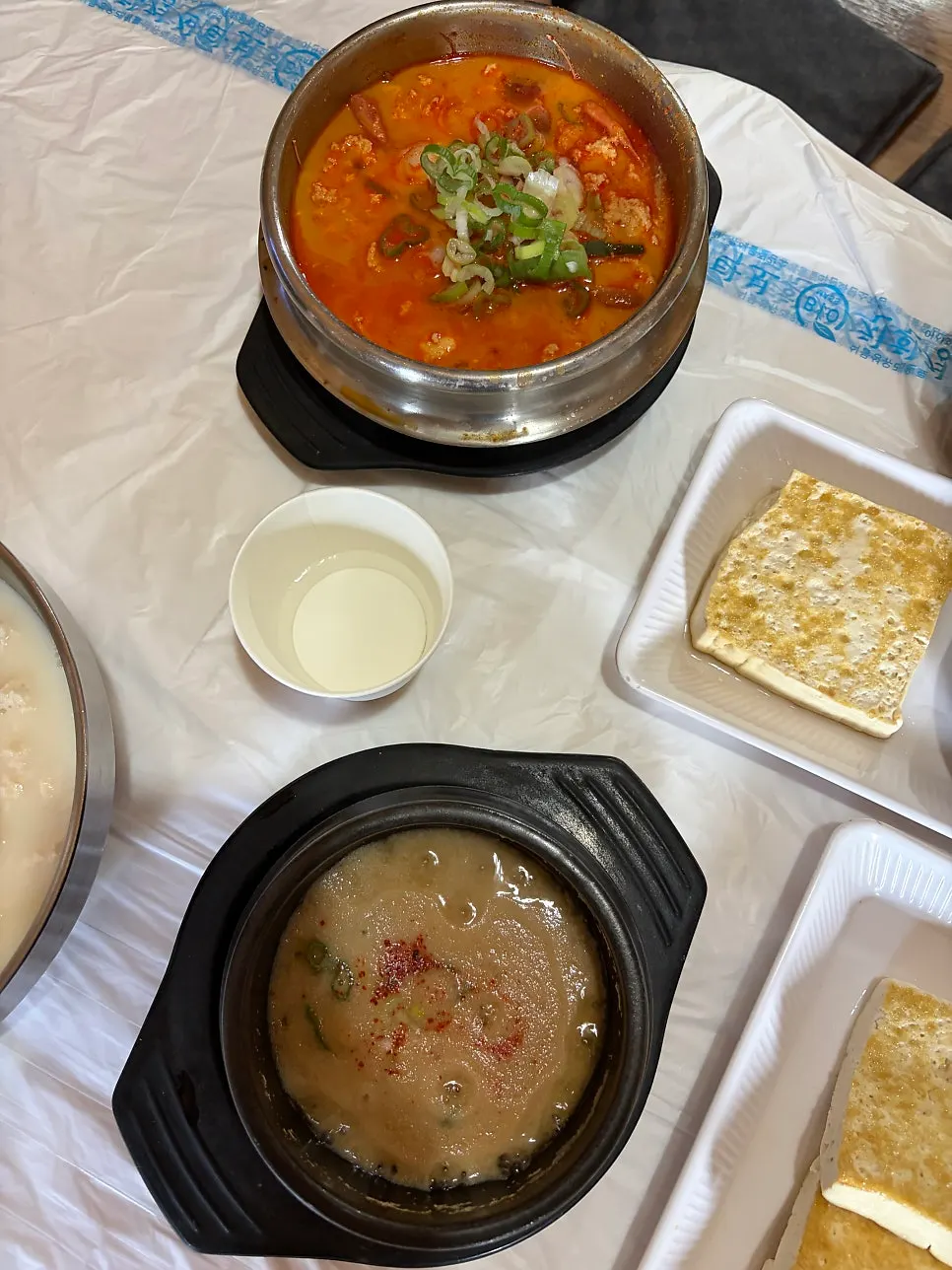 Spicy sundubu piled high with green onion