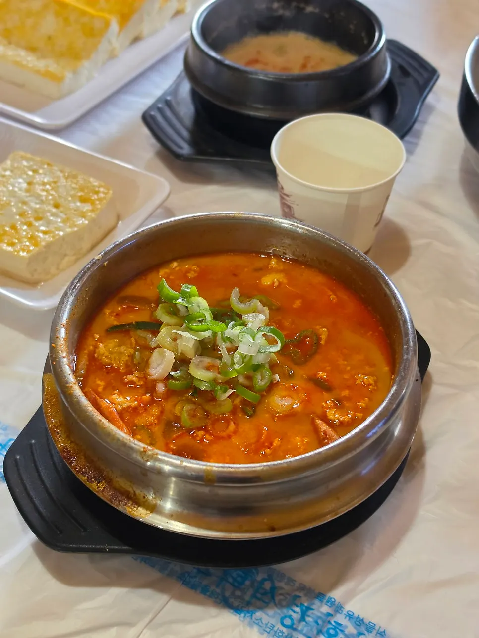 Close-up of spicy sundubu packed with soft tofu