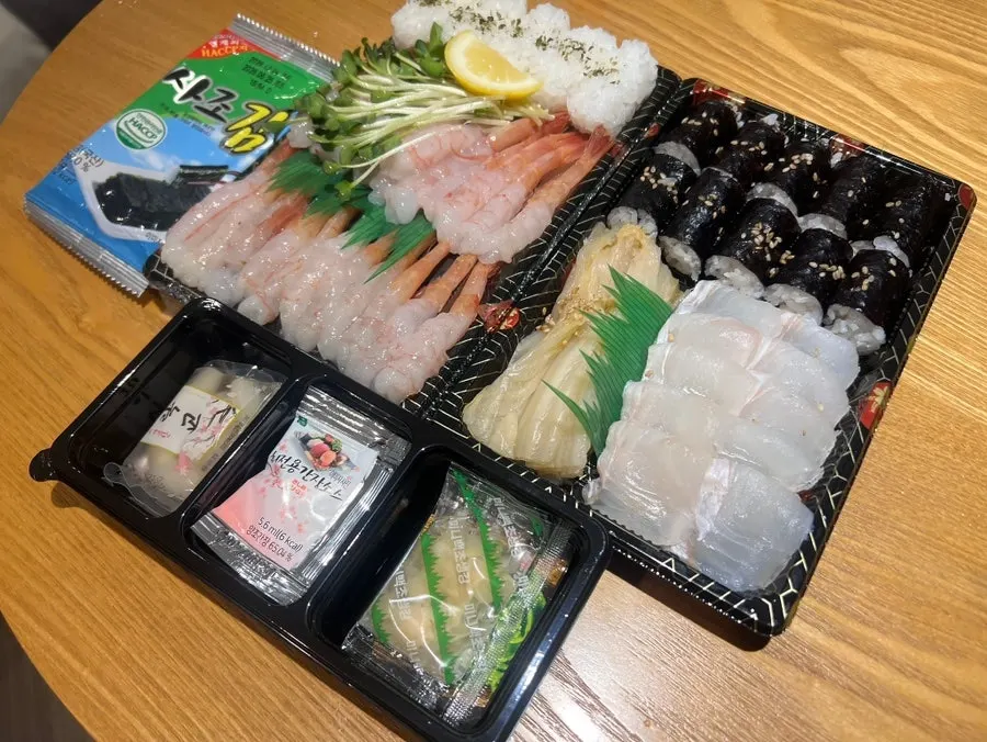 Packed Sokcho sweet shrimp sashimi and flounder–old kimchi salt gimbap