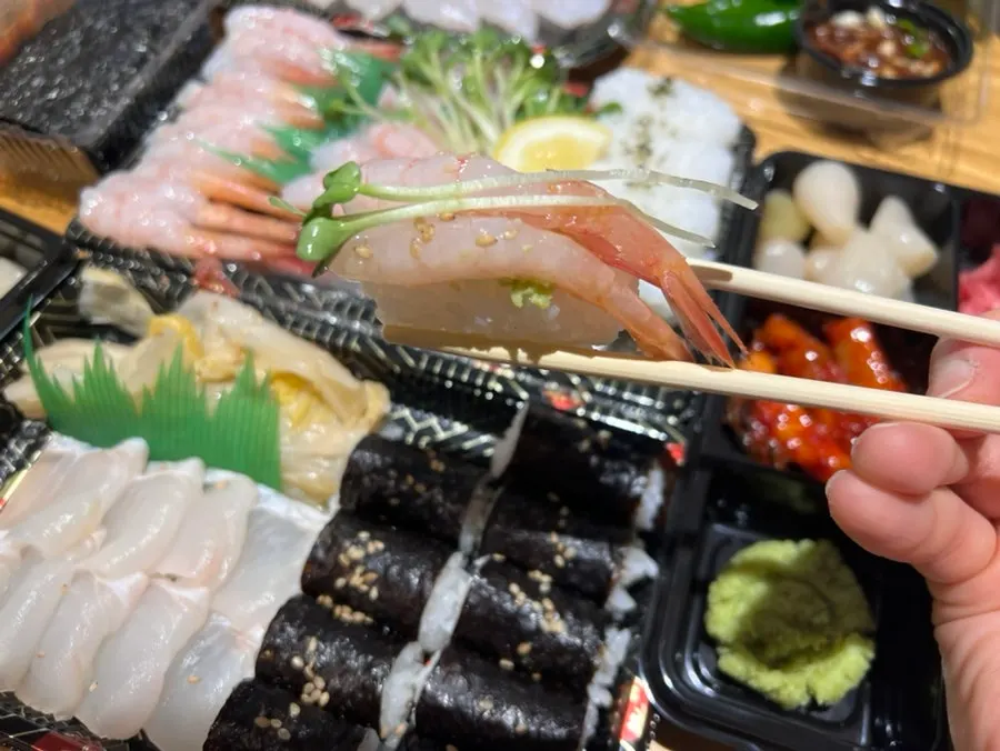 Peeled and prepped Sokcho sweet shrimp sashimi in a takeout pack