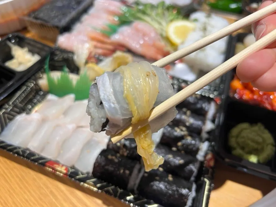 Flounder–old kimchi salt gimbap in its takeout packaging