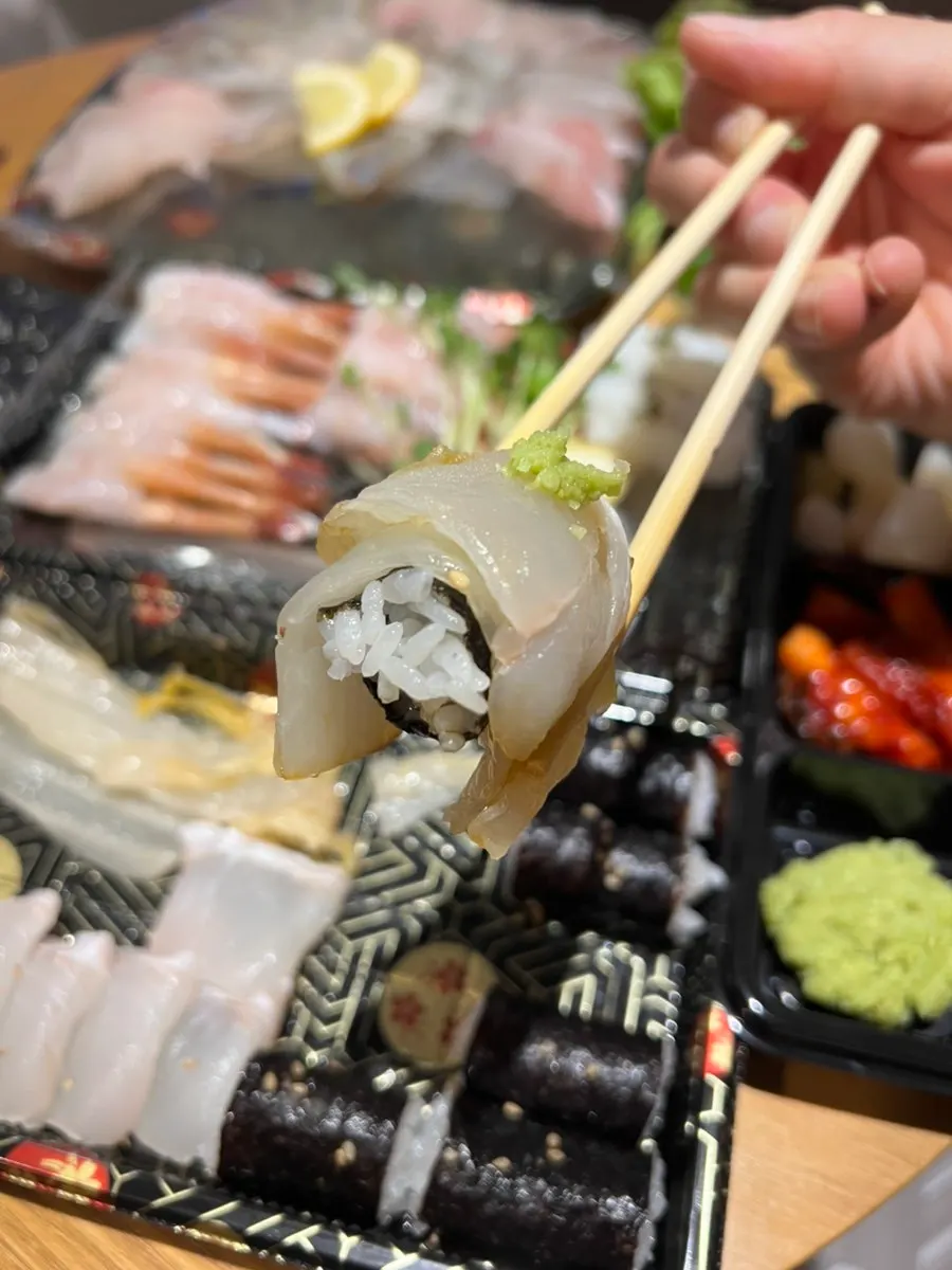 Cross-section of salt gimbap with flounder and old kimchi