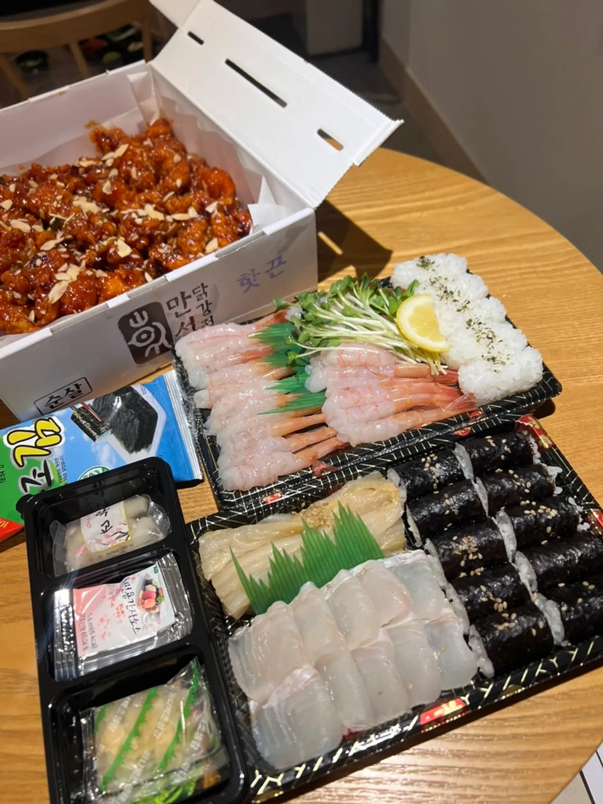 A full spread of packed sashimi and sushi from Sokcho Daeilho Bangeo