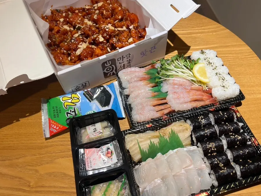 Enjoying Sokcho Jungang Market takeout food at the accommodation