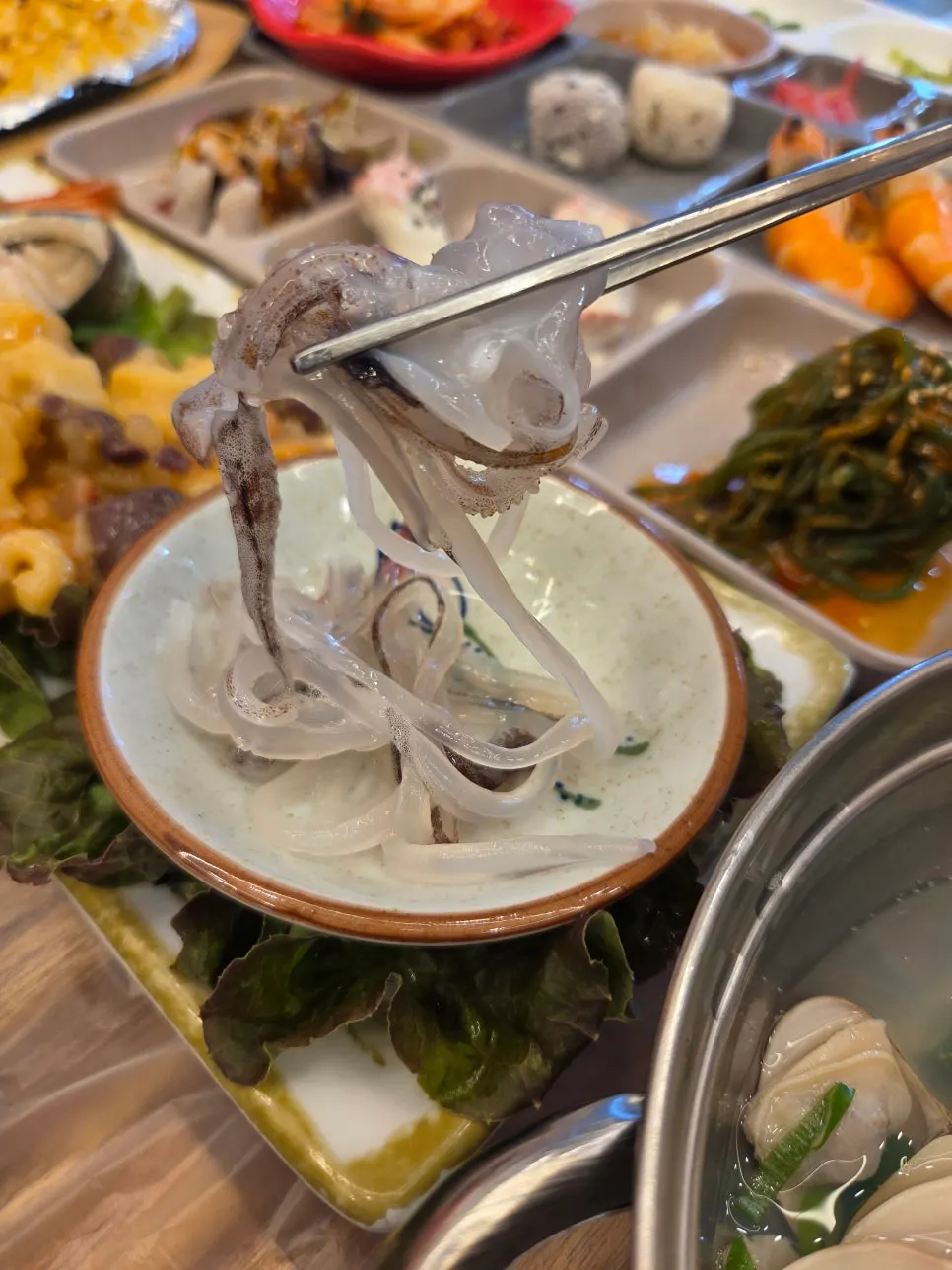 Plate of spot shrimp, abalone sashimi, sea squirt, and squid banchan