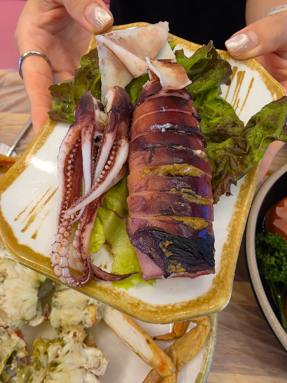 Complimentary steamed whole squid