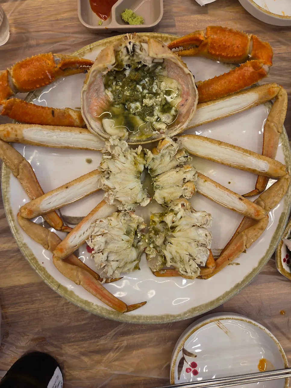 Whole extra-large snow crab prepped and served