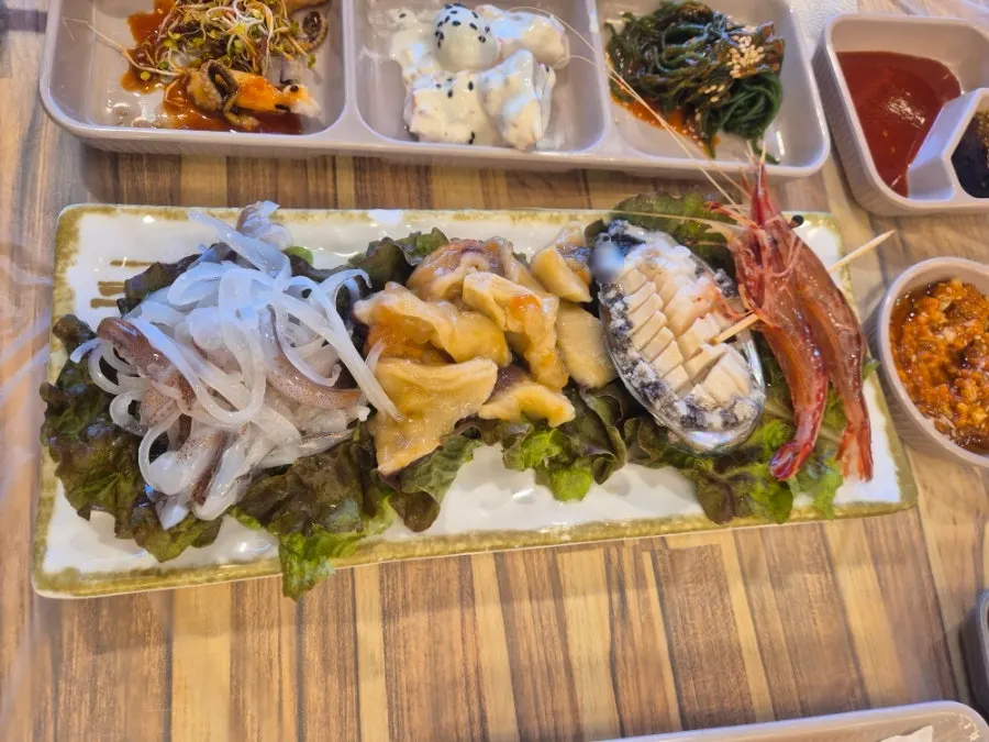 Full table of side dishes served with the King Crab Set