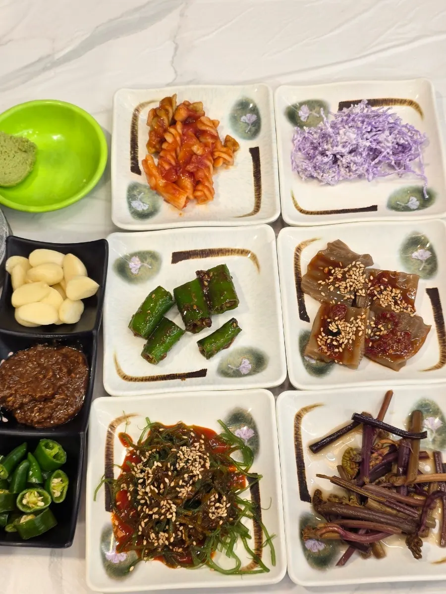 Assorted side dishes served at Hanggu Hwareo