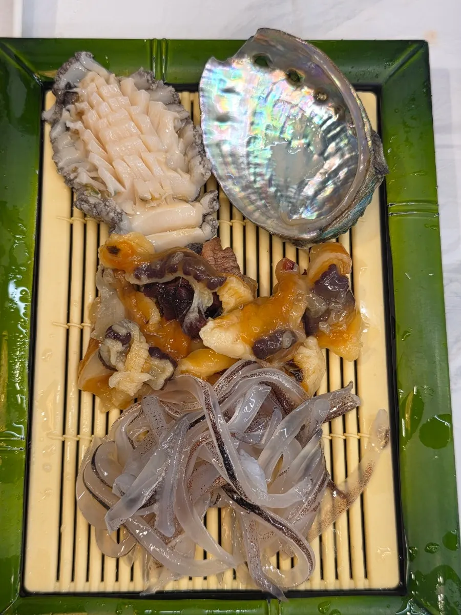 Side dish plate with pork cutlet, abalone, and sea cucumber