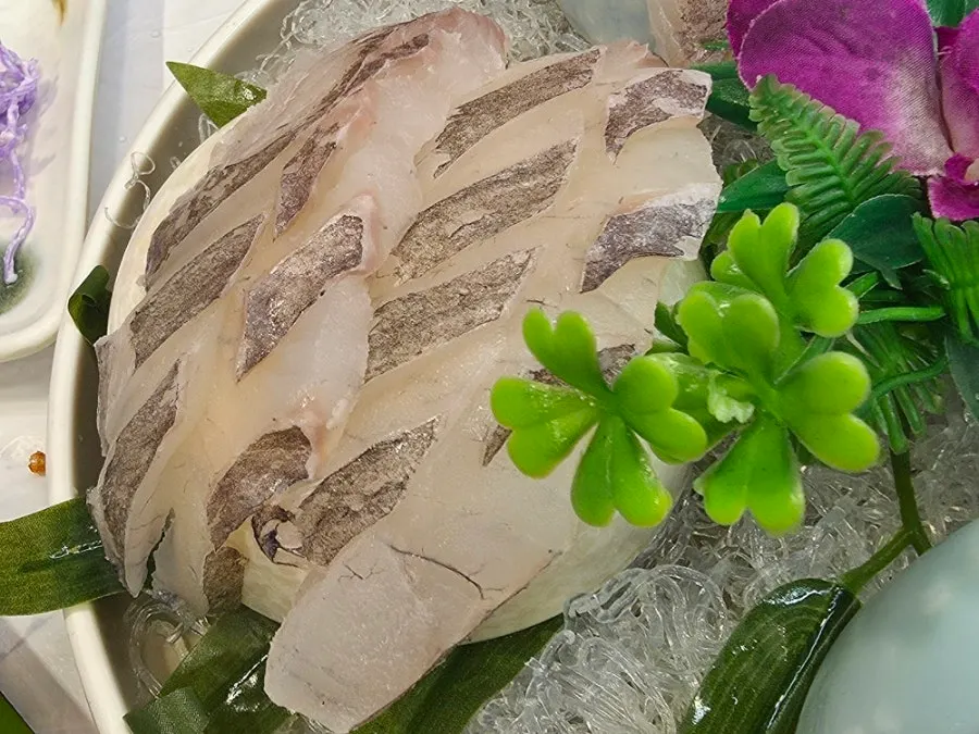 Close-up of thickly sliced raw fish sashimi