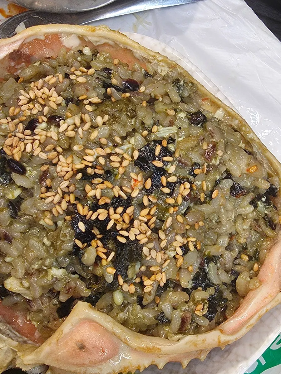 Spoonful of innard fried rice being lifted